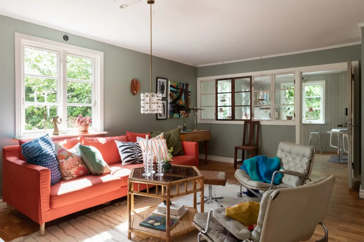 A Renovated 1920s Villa with a Spectacular Garden 12 living room colorful sofa
