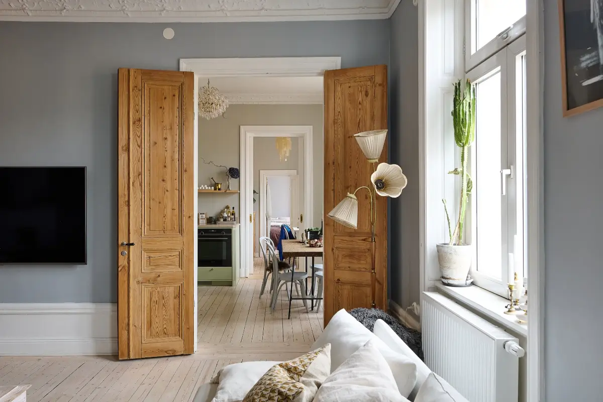 A Classic Stockholm Family Apartment with a Separate Studio 7 living room double wooden doors to kitchen