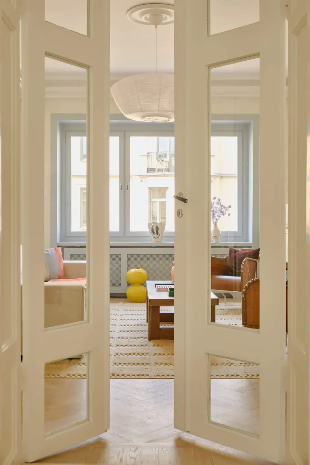 Pastel Hues in a Light-Filled 1880s Apartment in Stockholm 8 living room glass doors