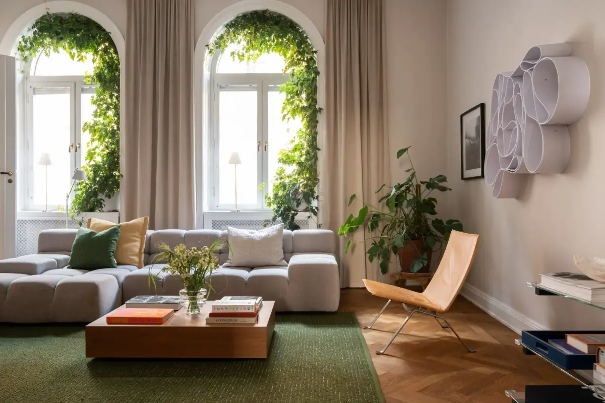 Arched Windows and Design Classics in a 19th Century Apartment 3 living room green rug