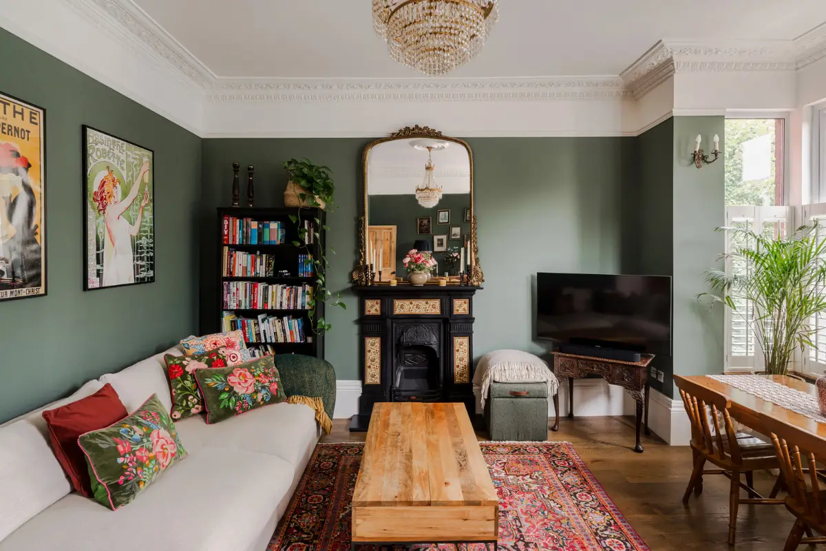 A Three-Bedroom Duplex Apartment with a Large Roof Terrace in London 1 living room green walls stucco fireplace