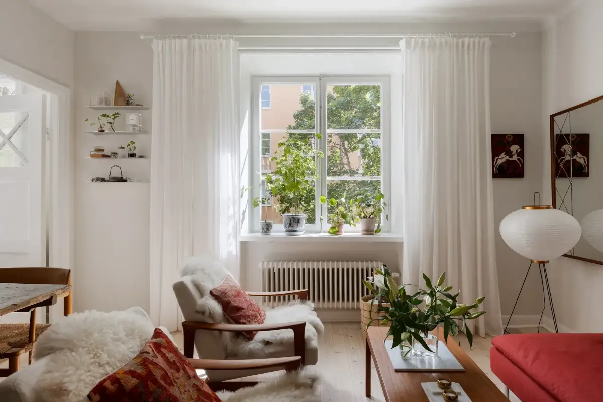 A Red Kitchen in a Small and Light Scandinavian Apartment 6 living room large window