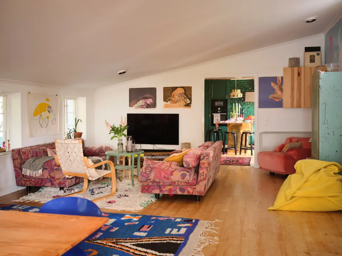 A Colorful Family Home in an Old Gardener's Cottage in Sweden 16 living room low slanted ceiling colorful decor