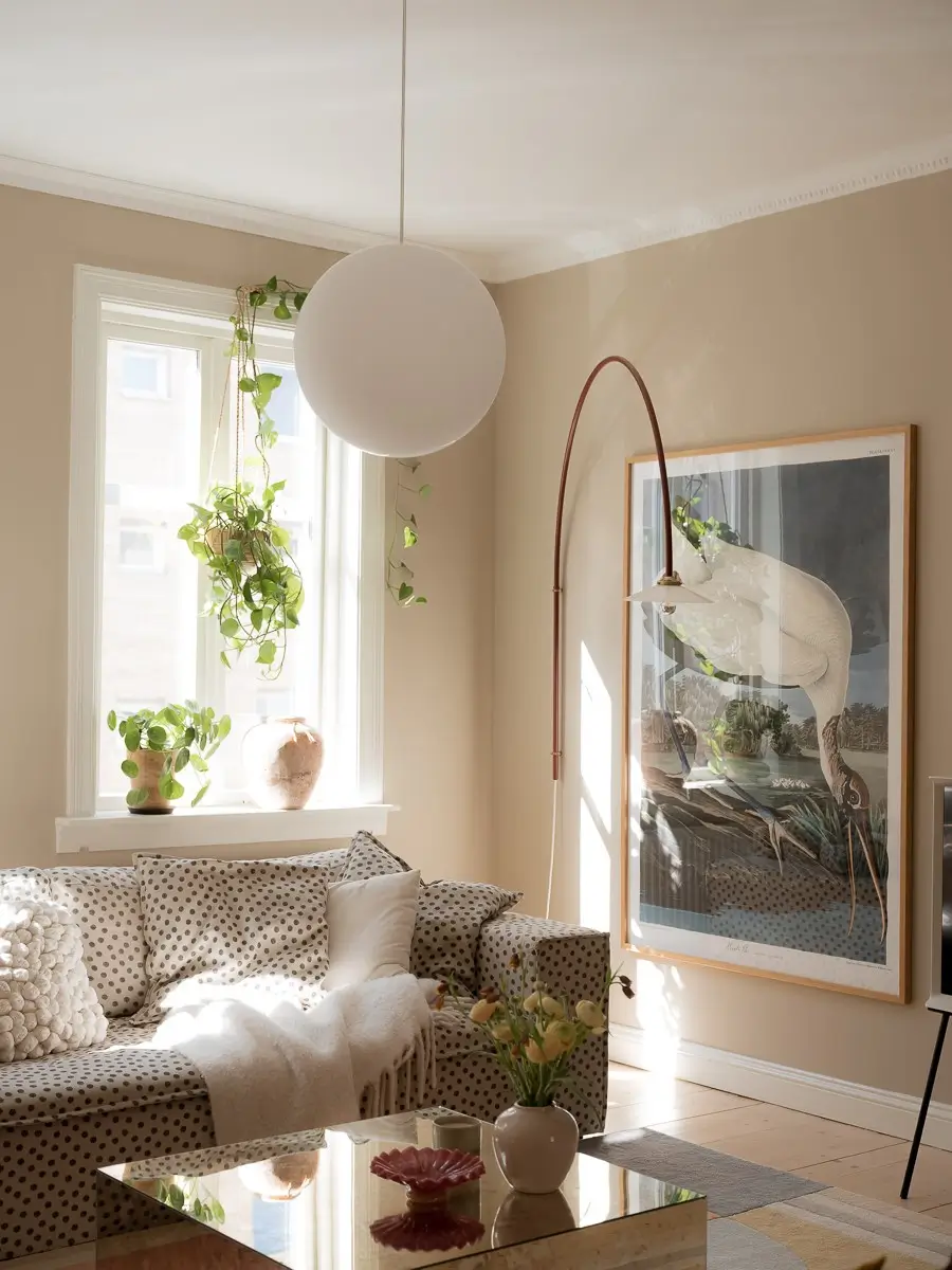 Neutral Shades and Period Elements in a Scandi Apartment 4 living room polkadot sofa arched wall lamp