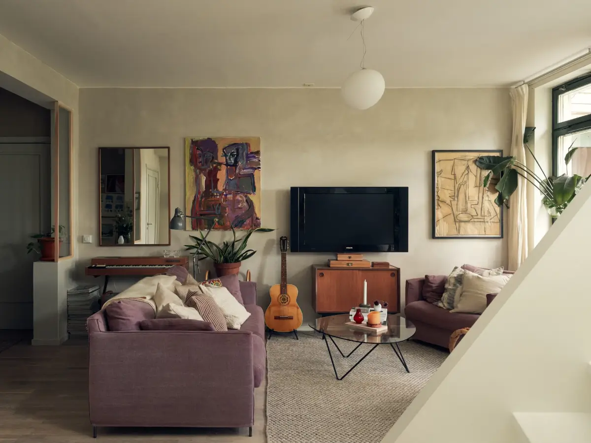 Industrial Elements in a 1960s Duplex Apartment in Stockholm 5 living room purple sofa