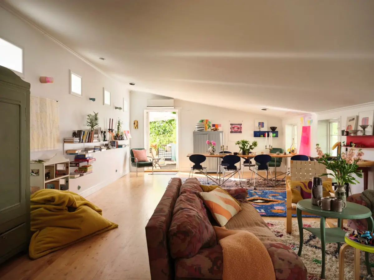 A Colorful Family Home in an Old Gardener's Cottage in Sweden 9 living room slanted ceiling