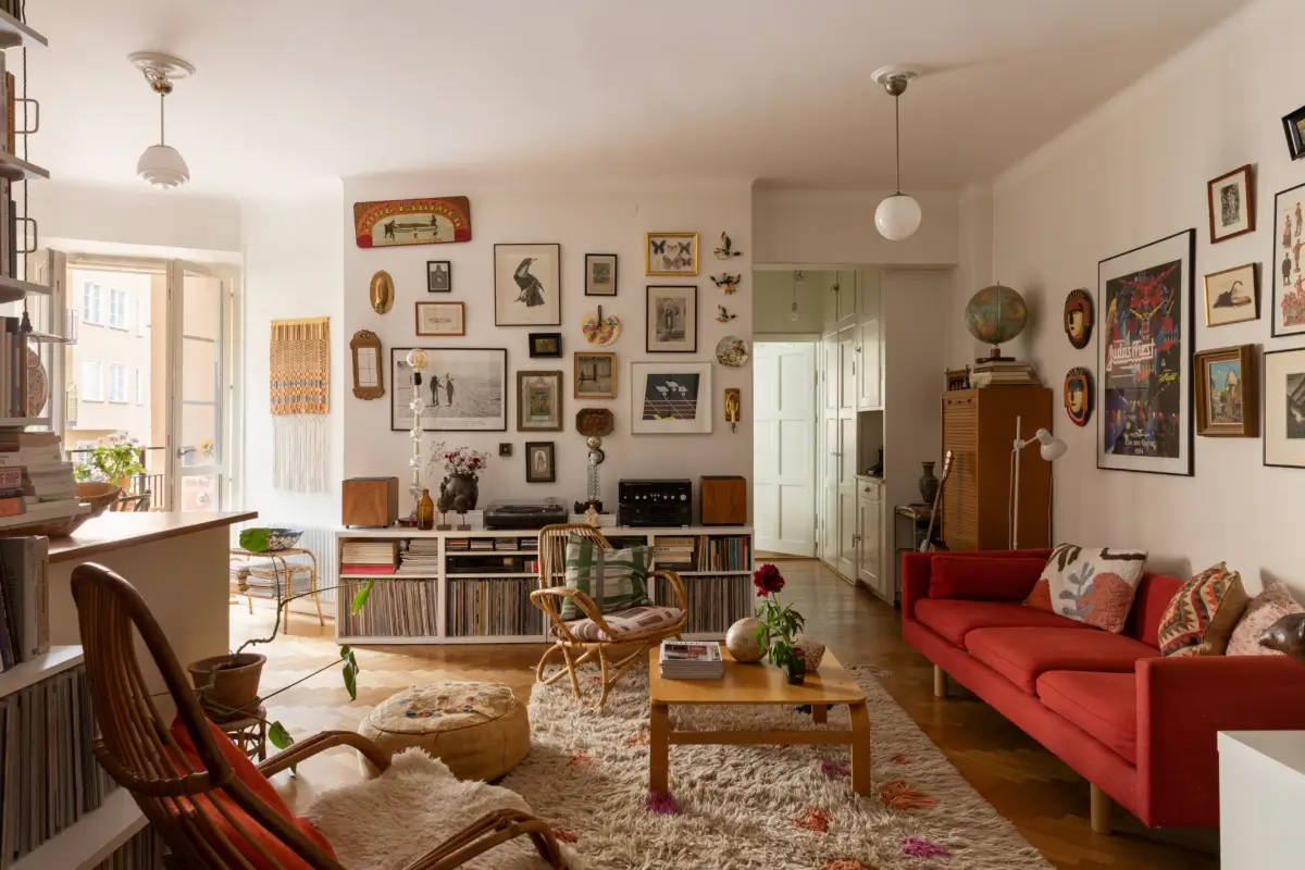 A Cozy 1920s Apartment Filled with Books, Art, and Music 1 living room with art bookshelves and music storage