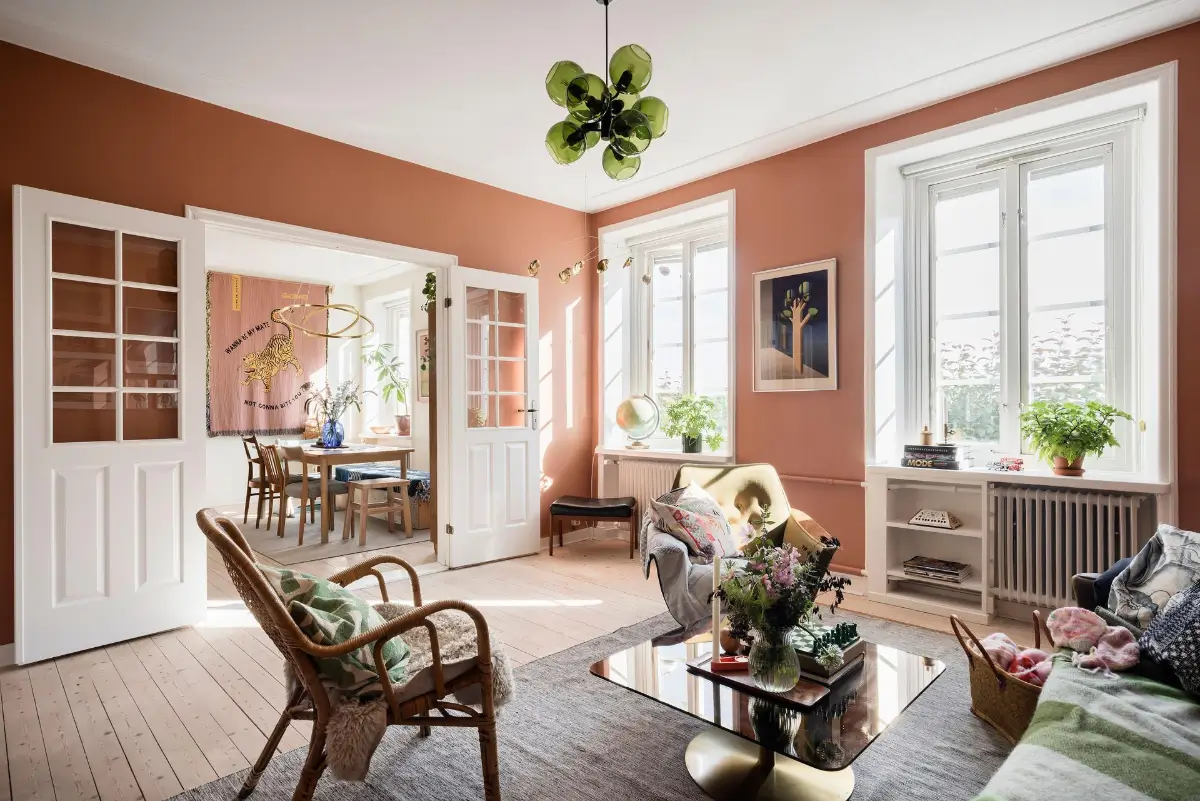 living room wooden floor terracotta walls deep window niches