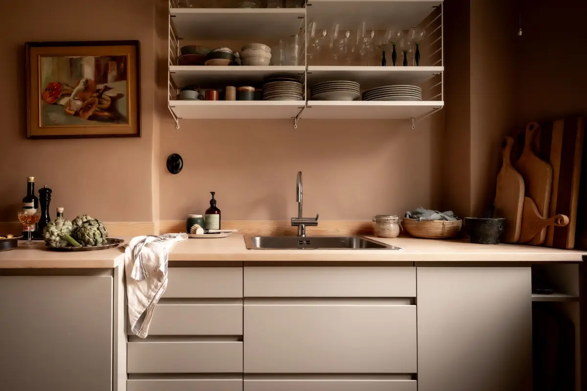An Earthy Color Palette and Exposed Brick in a 1940s Apartment 12 modern scandinavian kitchen open shelves