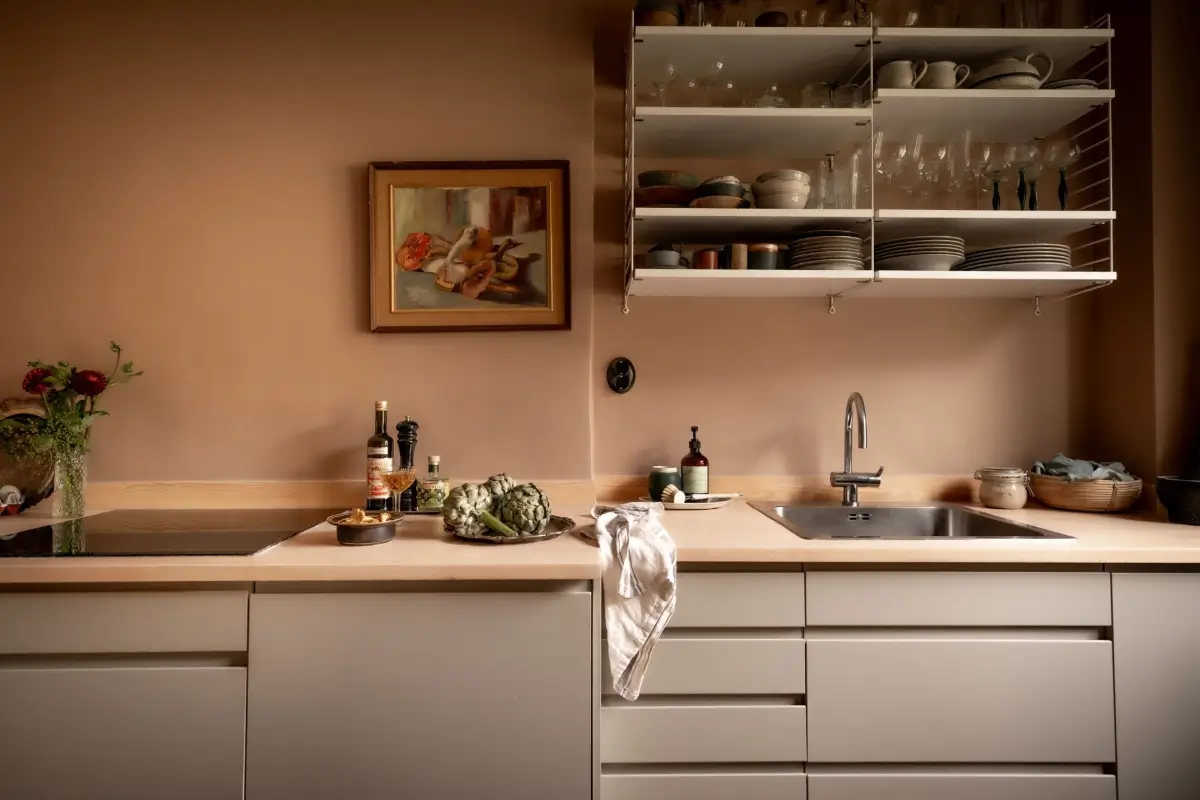 An Earthy Color Palette and Exposed Brick in a 1940s Apartment 14 open kitchen shelves light gray cabinets