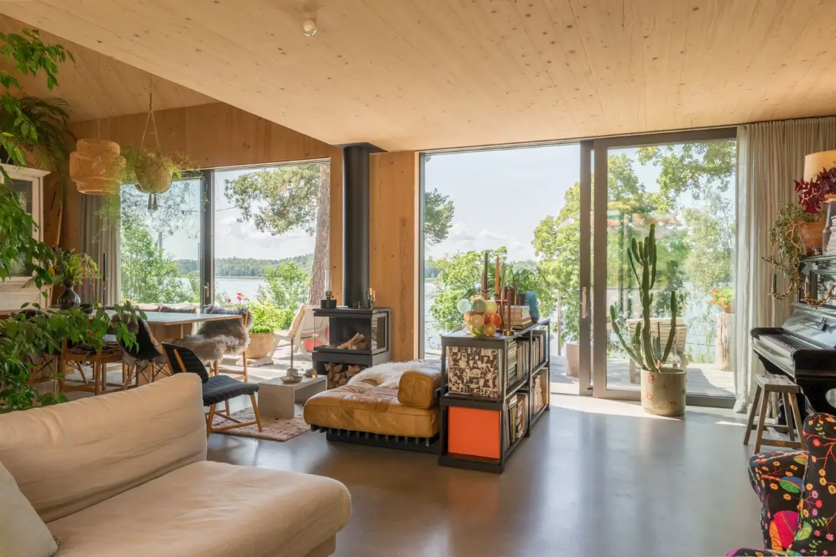 A Modern Wooden Cottage with Sea Views Close to Stockholm 9 open plan living space sliding doors terrace