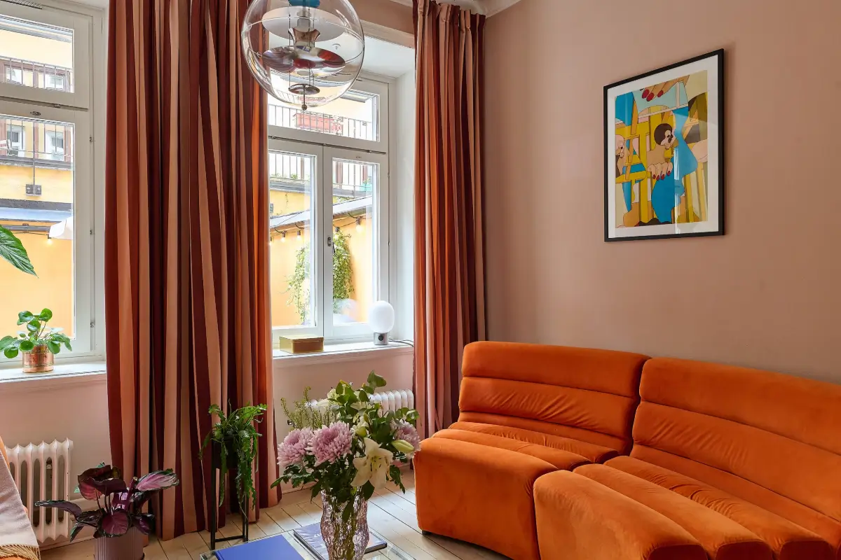 The 2026 Home Decor and Color Trends, According to Pinterest 31 orange sofa pink living room