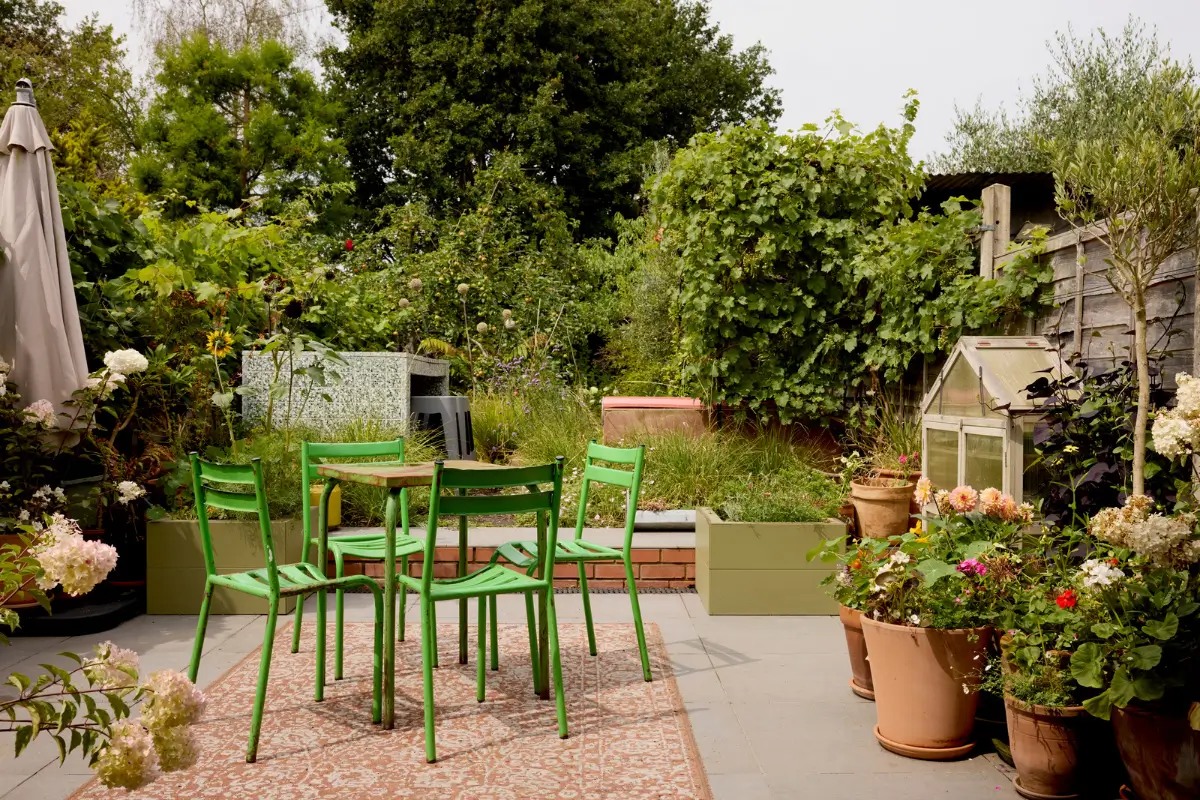 A Victorian Home with a Rich Color Palette and a Lush Garden 24 paved garden terrace