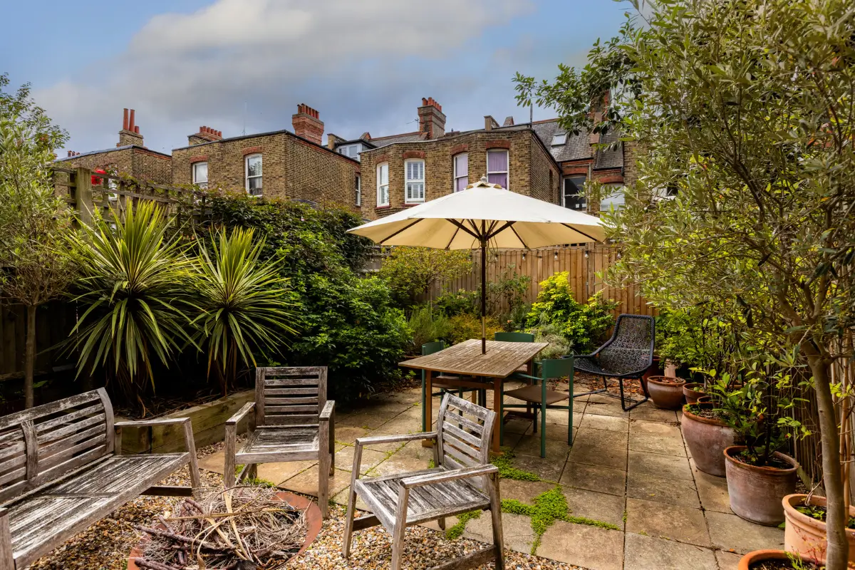 A Modern Extension and Period Details in a Ground Floor London Home 9 paved garden