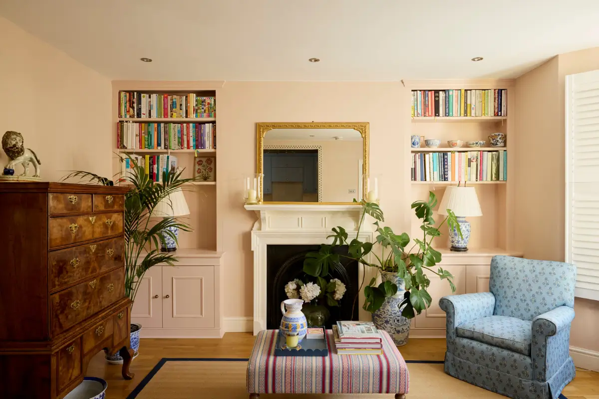 Pastel Hues in a Two-Bedroom Garden Apartment in West Kensington 1 pink living room fireplace built-in shelves nordroom