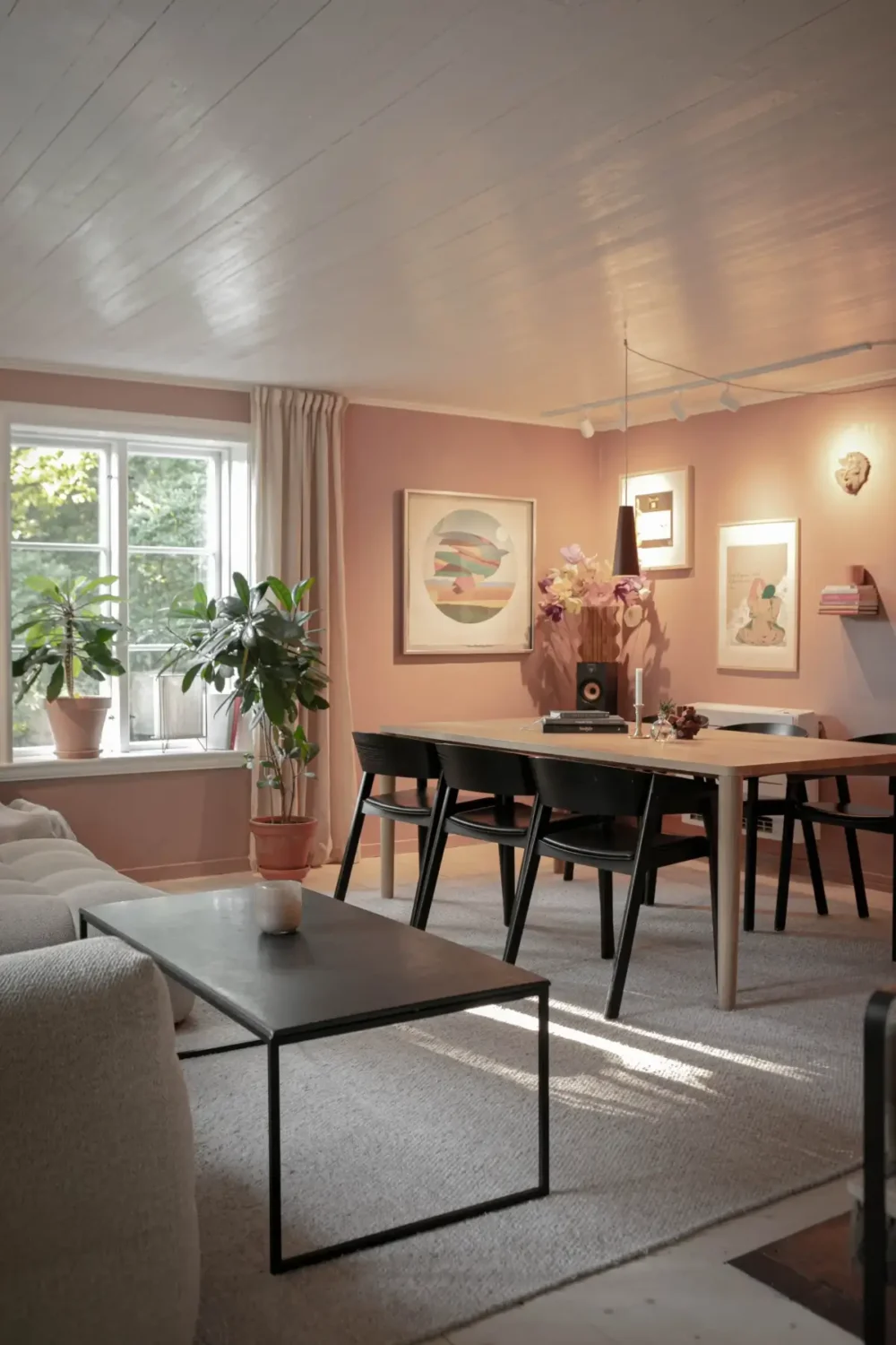 Modern Comforts and Historic Architecture in an 18th Century Home 11 pink living room with dining table