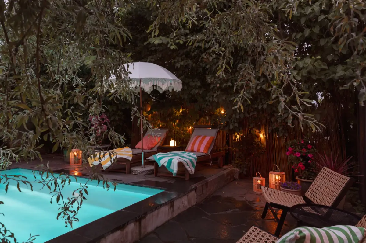 A Renovated 1920s Villa with a Spectacular Garden 36 pool sun beds at night A Renovated 1920s Villa with a Spectacular Garden