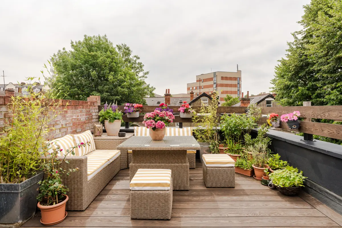 A Three-Bedroom Duplex Apartment with a Large Roof Terrace in London 24 roof terrace furniture striped cushions