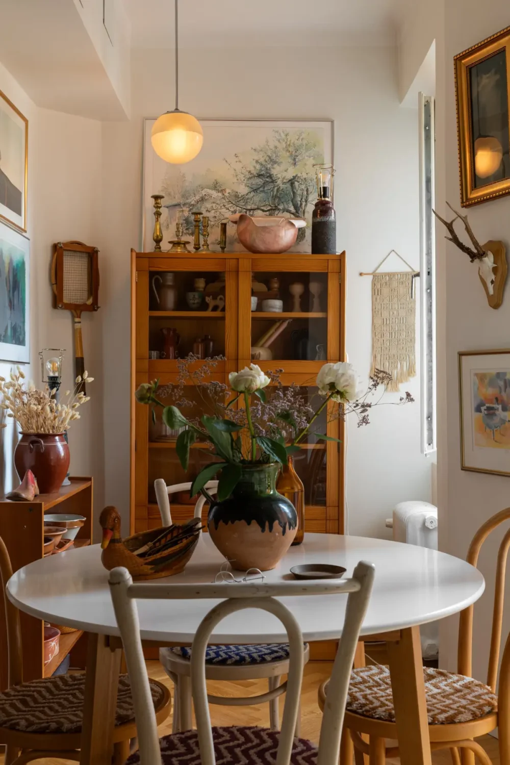A Cozy 1920s Apartment Filled with Books, Art, and Music 11 round dining table