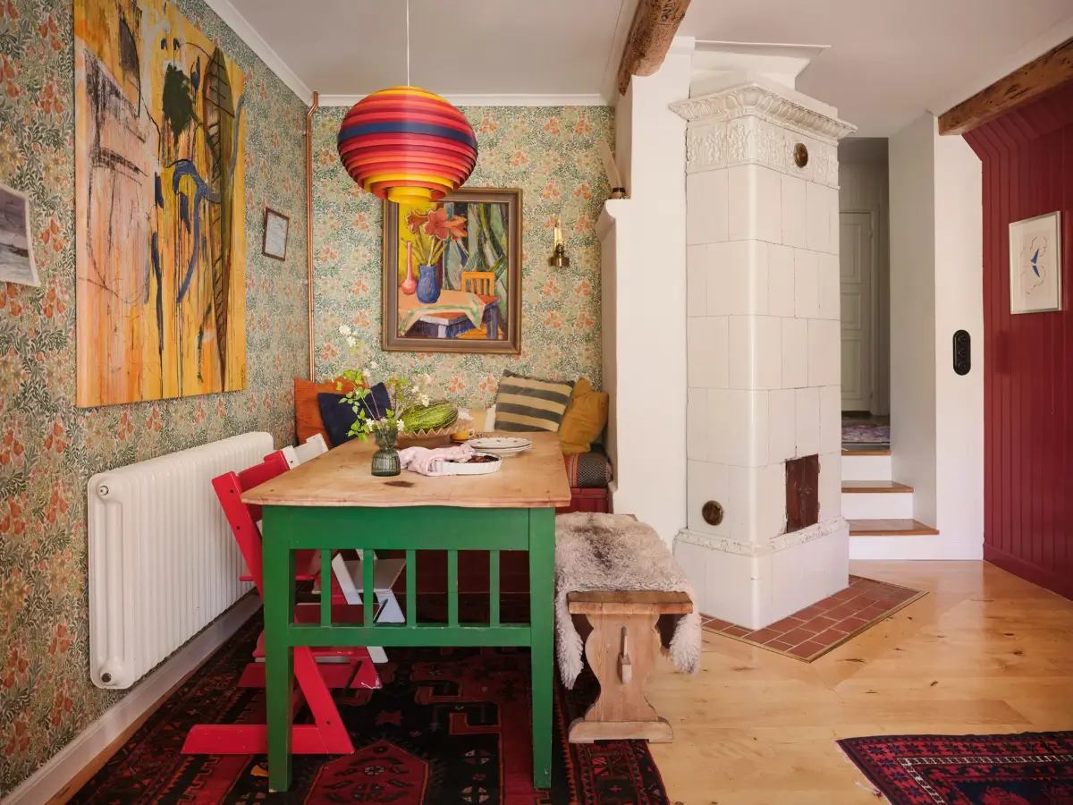 A Colorful Family Home in an Old Gardener's Cottage in Sweden 6 rustic green kitchen table colorful wallpaper nordroom
