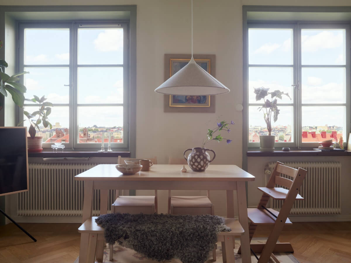A Stockholm Apartment with a Butter-Yellow Bedroom 4 scandi dining table with bench