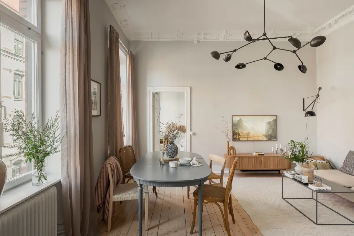 A Gray Scandinavian Apartment with a Royal History 5 scandi living room blue dining table