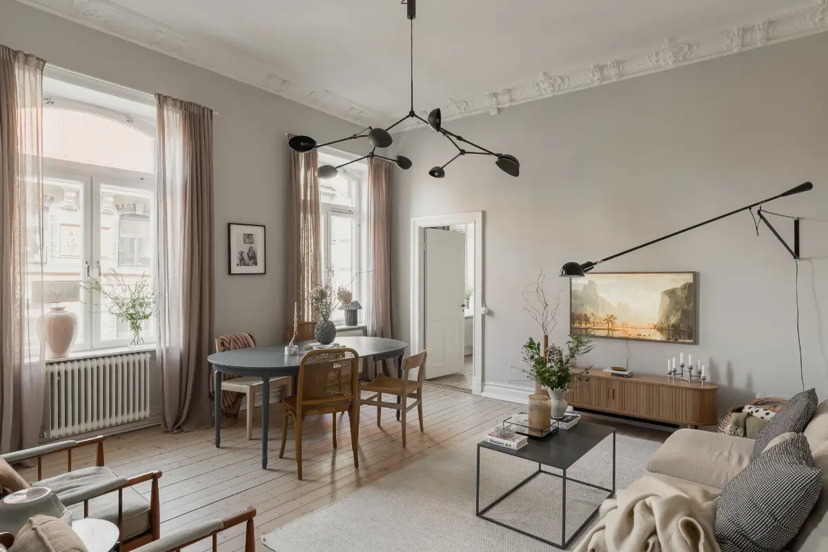 A Gray Scandinavian Apartment with a Royal History 1 scandi living room light gray walls white stucco nordroom