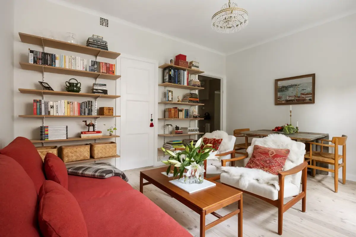A Red Kitchen in a Small and Light Scandinavian Apartment 9 scandi living room red color accents