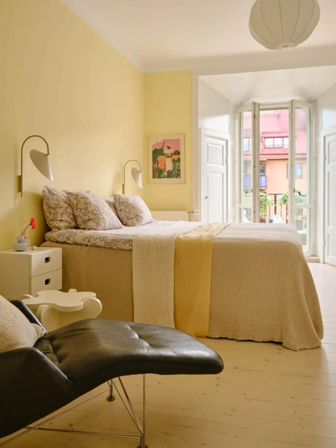 Pastel Hues in a Light-Filled 1880s Apartment in Stockholm 11 scandinavian-bedroom-wooden-floor-butter-yellow-walls-nordroom