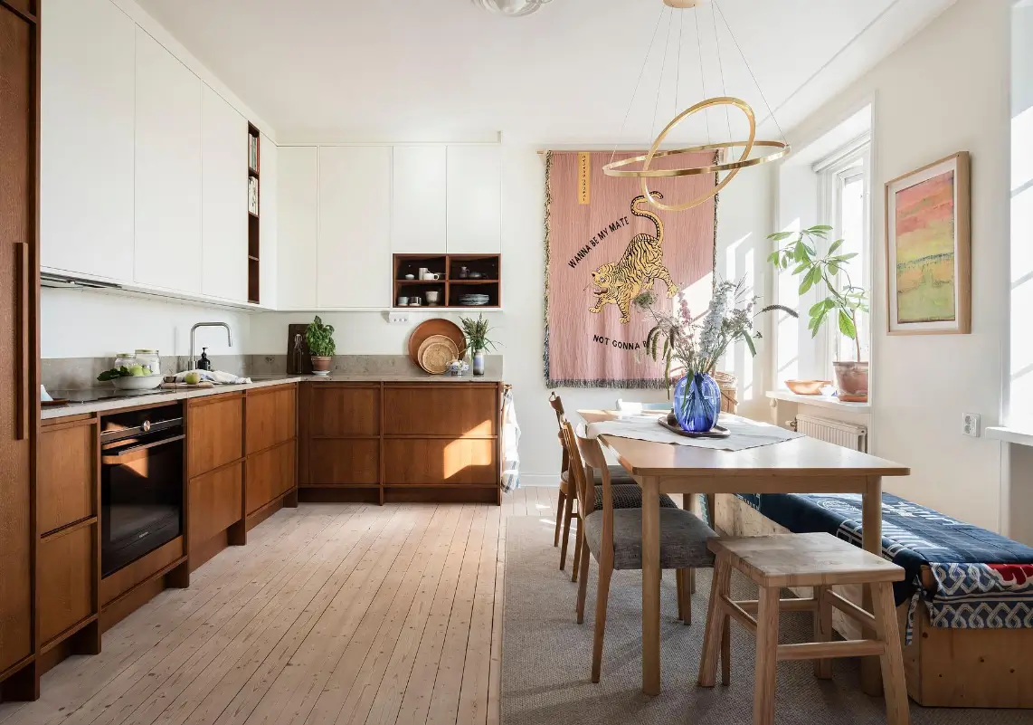 A Colorful 1920s Family Apartment in Sweden 11 scandinavian kitchen with wooden dining table
