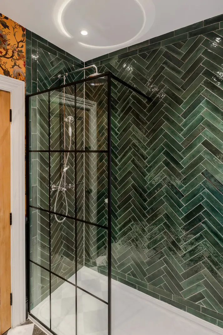 A Three-Bedroom Duplex Apartment with a Large Roof Terrace in London 13 shower green herringbone patterned tiles
