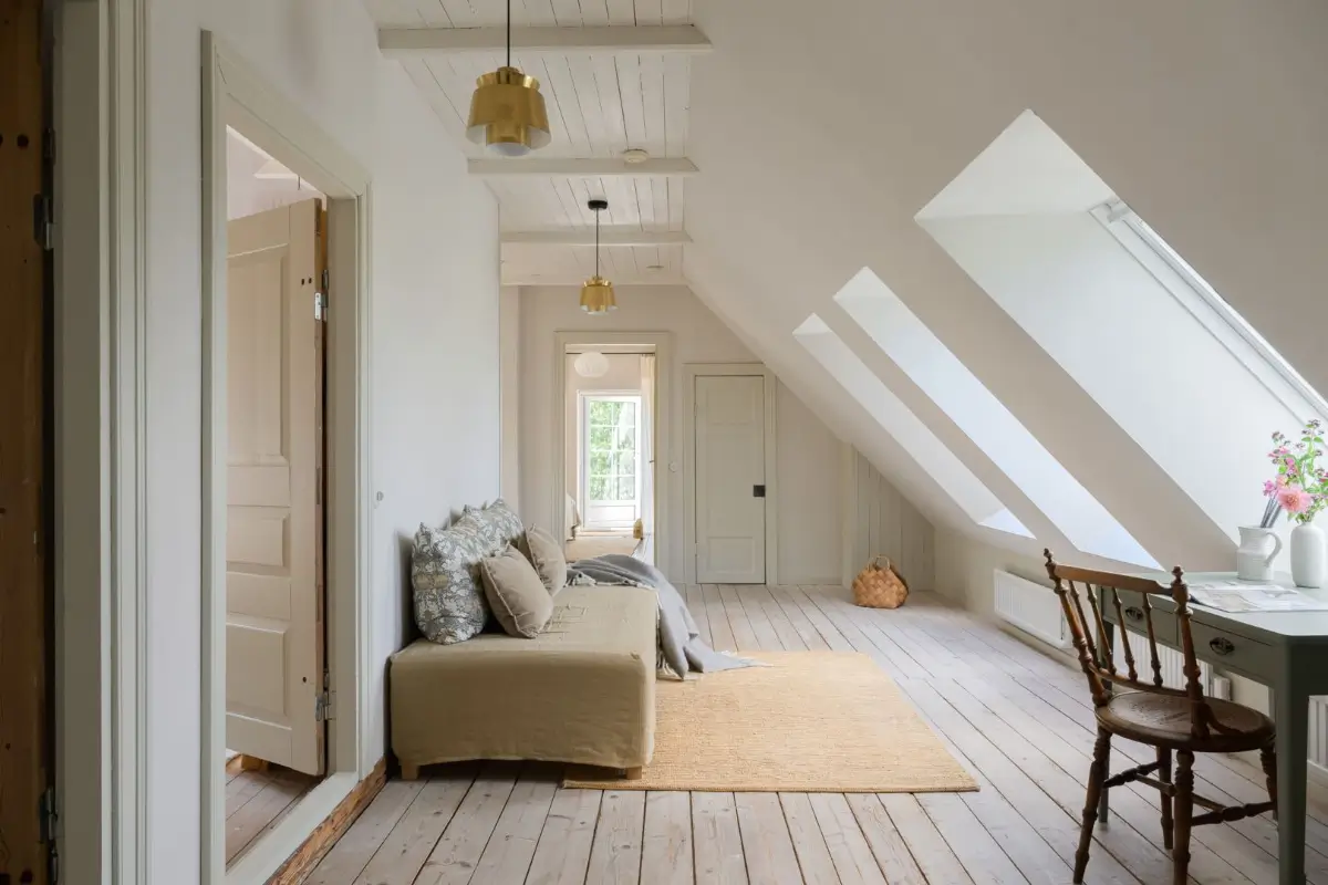 Historic Character and a deVOL Kitchen in a Swedish Country House 35 sitting room slanted ceiling velux windows