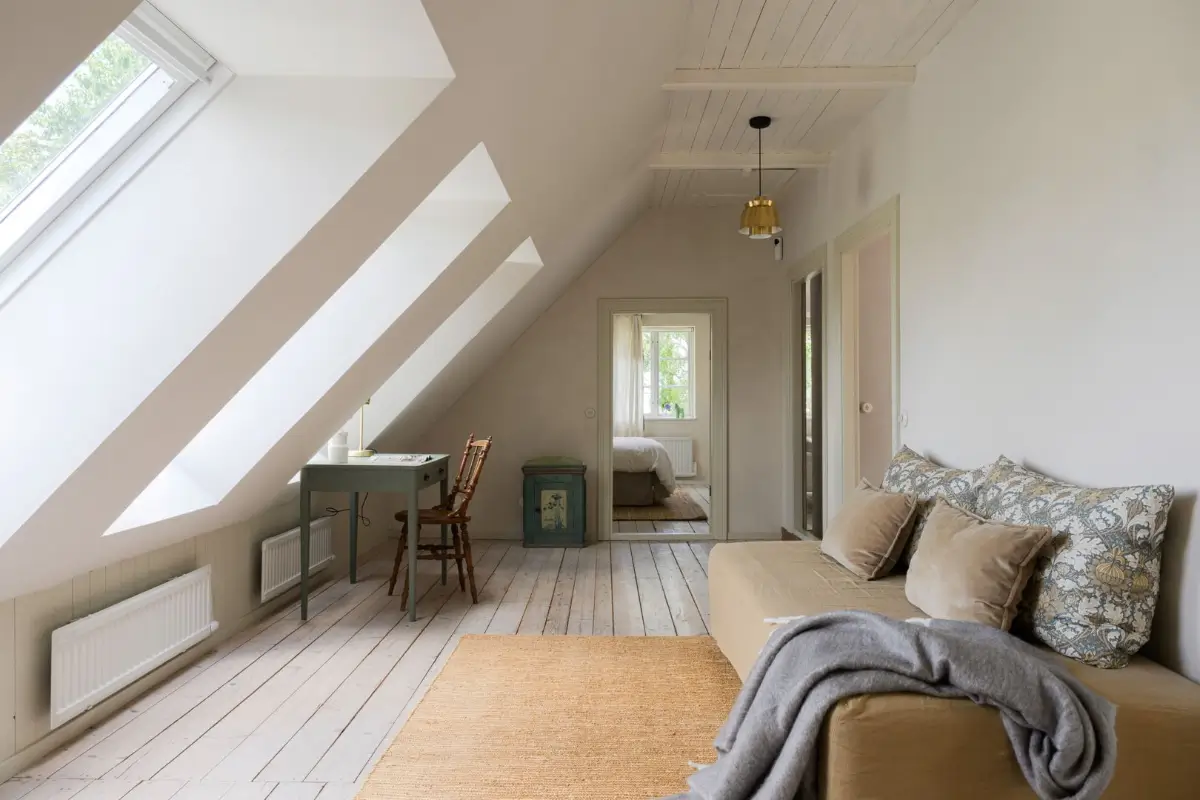 Historic Character and a deVOL Kitchen in a Swedish Country House 33 sitting room slanted ceiling