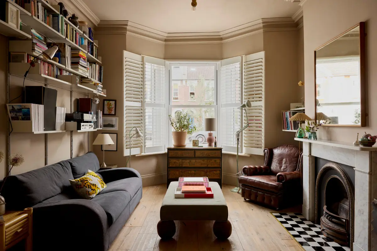 sitting room with bay window and marble fireplace
