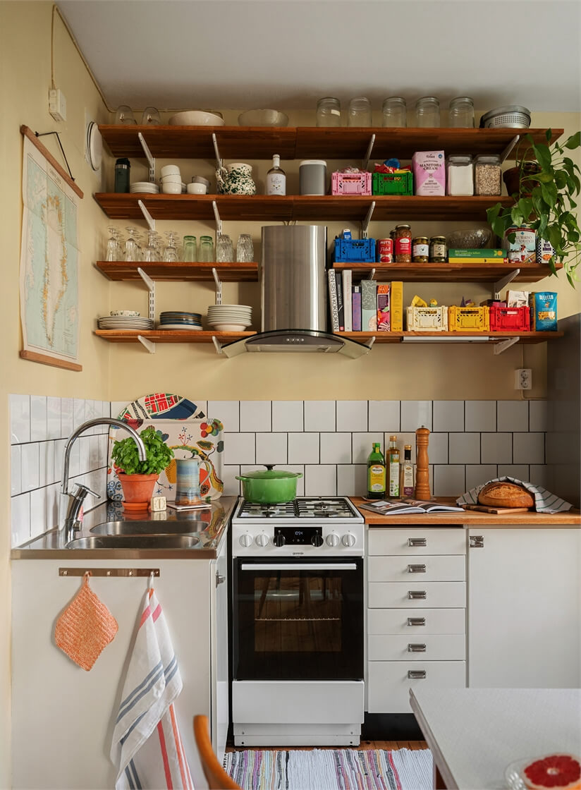 Small Space, Big Style: How to Design a Teeny-Tiny Kitchen That Works 7 small midcentury kitchen wooden shelves butter-yellow walls nordroom