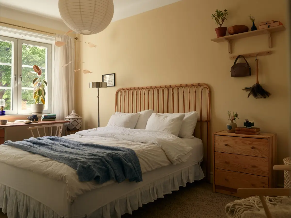 A Muted Color Palette in a Cozy 1920s Apartment in Stockholm 13 soft beige-yellow walls bedroom nordroom