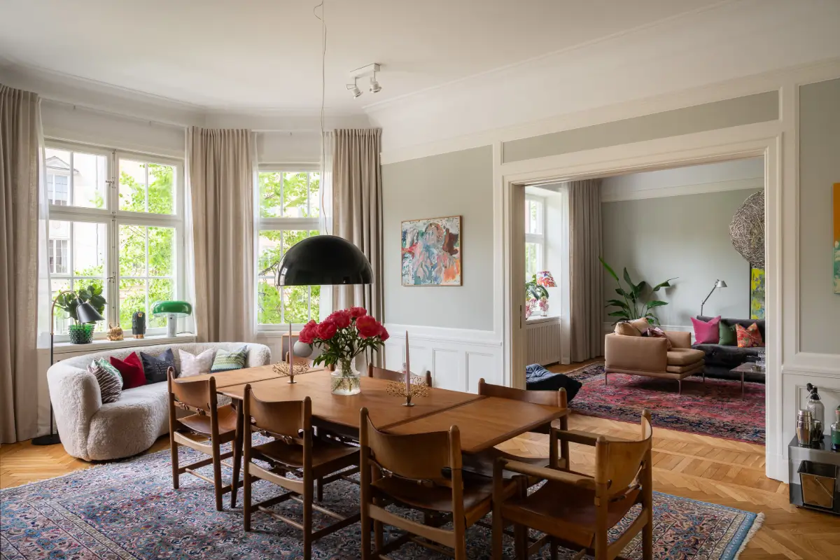 A Classic Stockholm Apartment with a Sky-Blue Kitchen 1 spacious dining room bay window blue rug