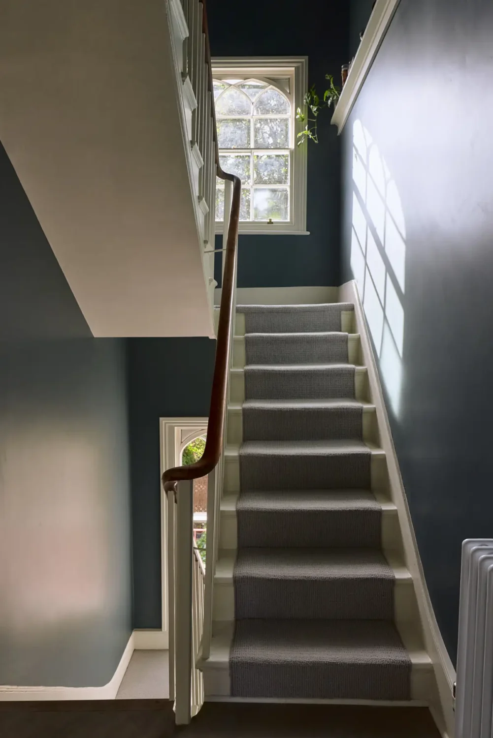 A Classic Victorian Duplex with a Lush, Private Garden in London 15 staircase dark blue walls