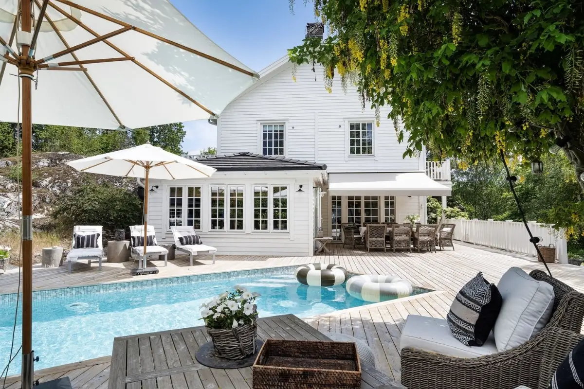 Scandinavian Design Meets The Hamptons in a Swedish Country House 51 swimming pool white coastal-style swedish country house nordroom