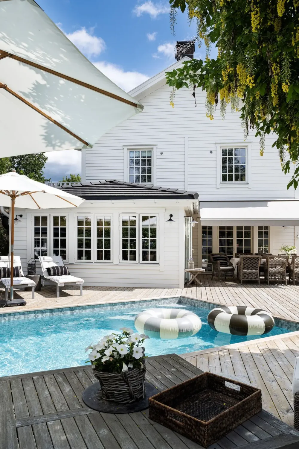 Scandinavian Design Meets The Hamptons in a Swedish Country House 50 swimming pool white swedish country house