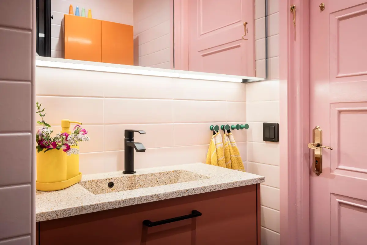 A Colorful 1920s Family Apartment in Sweden 35 terrazzo sink pink bathroom
