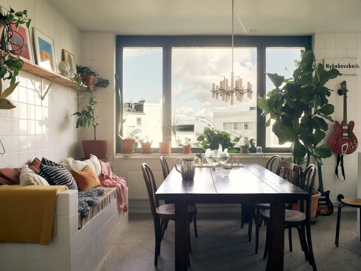Industrial Elements in a 1960s Duplex Apartment in Stockholm 23 tiled bench wooden dining table