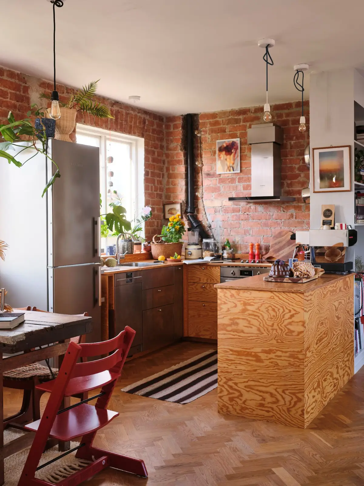 u-shaped wood kitchen exposed brick