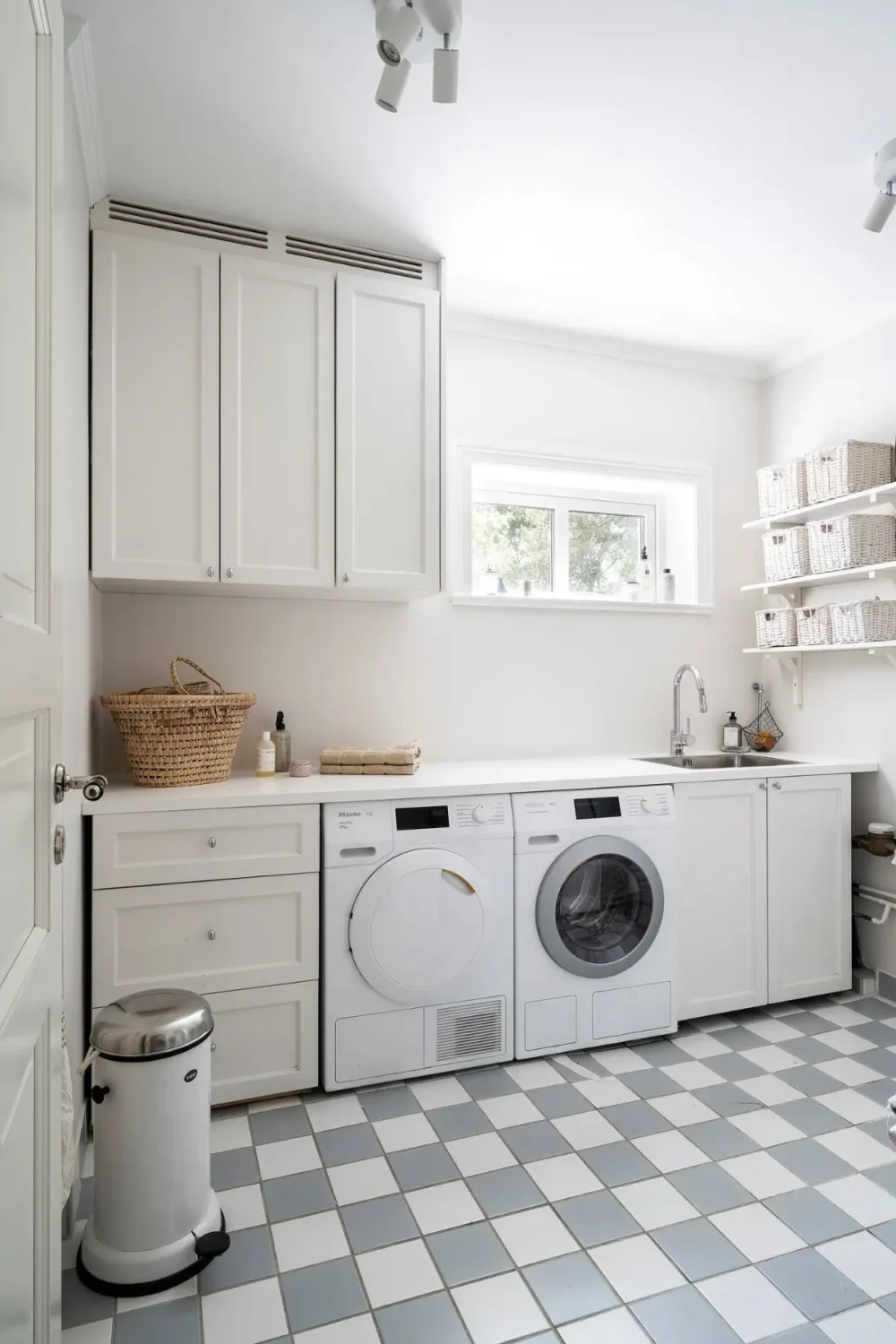 Scandinavian Design Meets The Hamptons in a Swedish Country House 31 utility room checkered floor