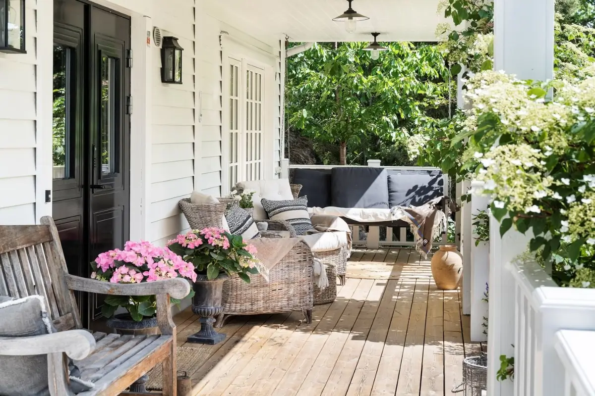 Scandinavian Design Meets The Hamptons in a Swedish Country House 4 veranda-wicker-seating