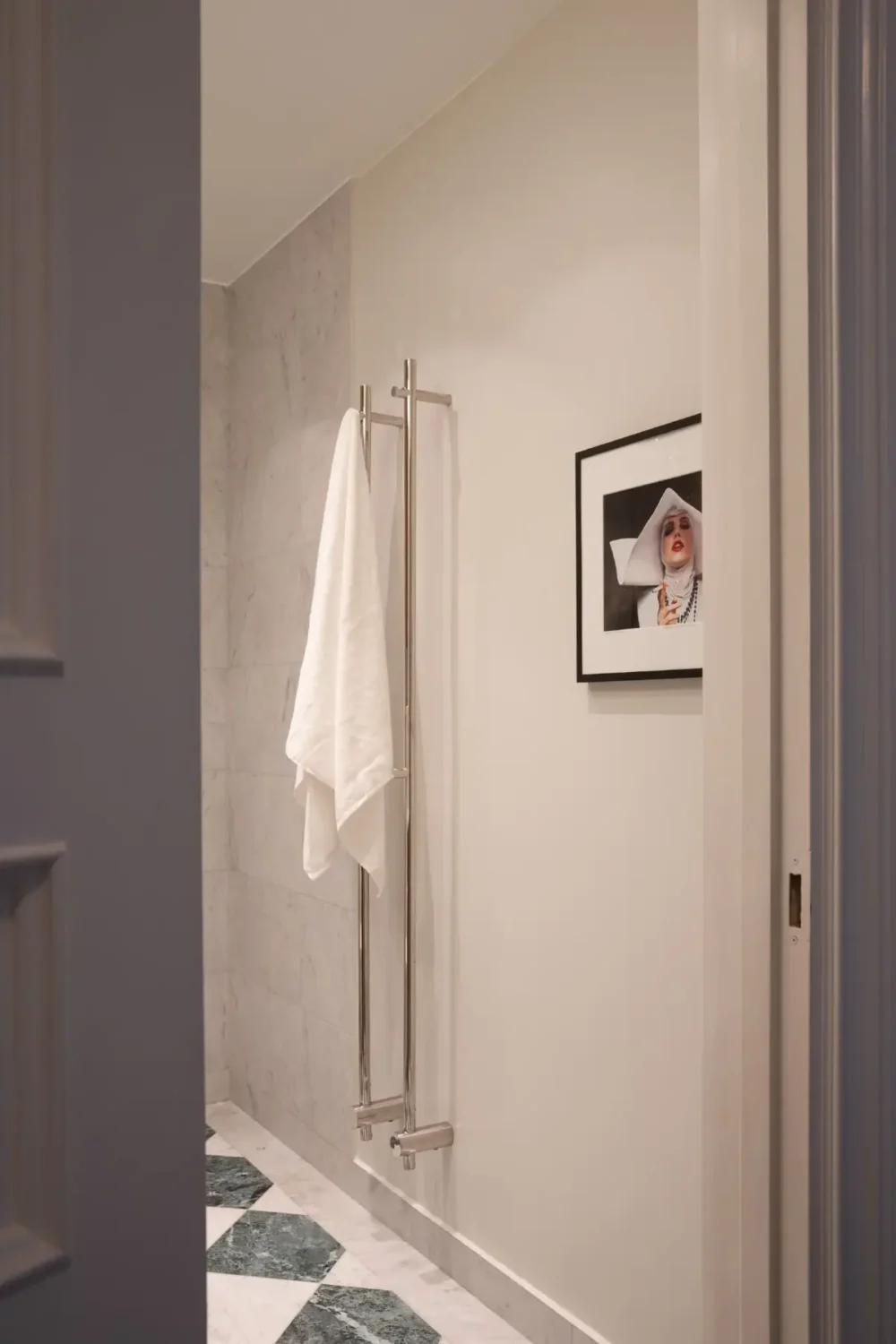 Arched Windows and Design Classics in a 19th Century Apartment 20 view into bathroom