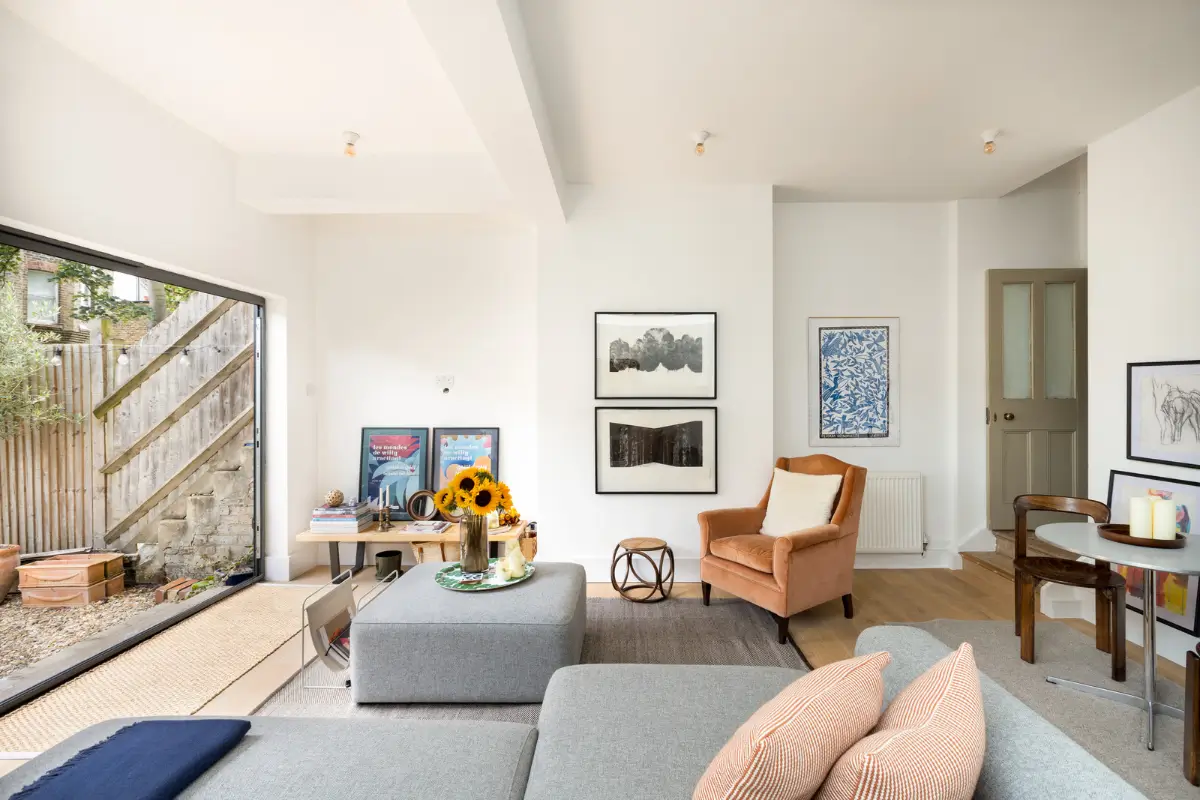 A Modern Extension and Period Details in a Ground Floor London Home 2 white living room large glass doors to garden
