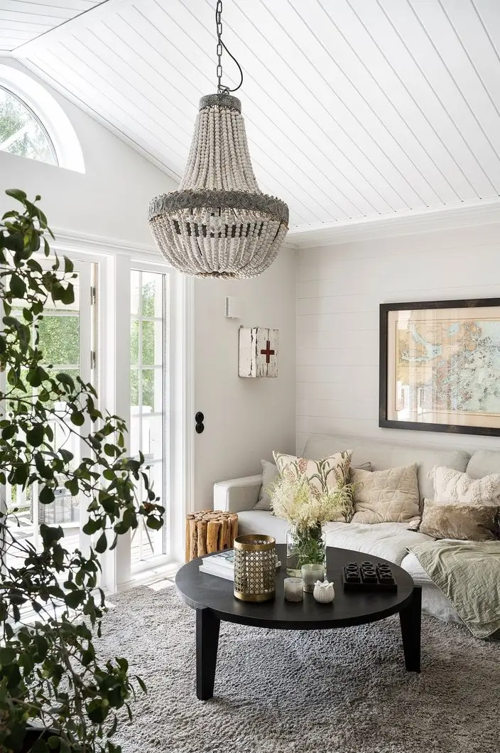 Scandinavian Design Meets The Hamptons in a Swedish Country House 37 white sitting room wooden pitched ceiling coastal style nordroom