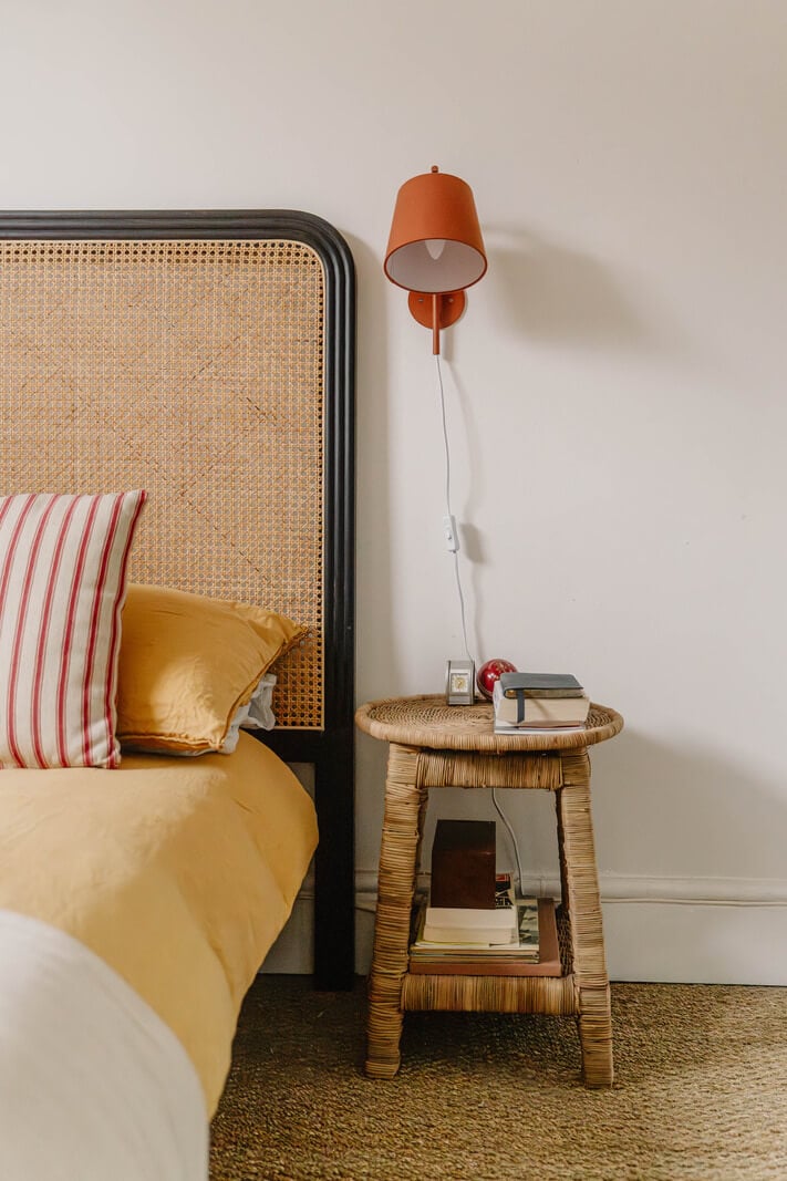 A Modern Ground-Floor Apartment with a Tiny Patio Garden 18 wicker bedside table