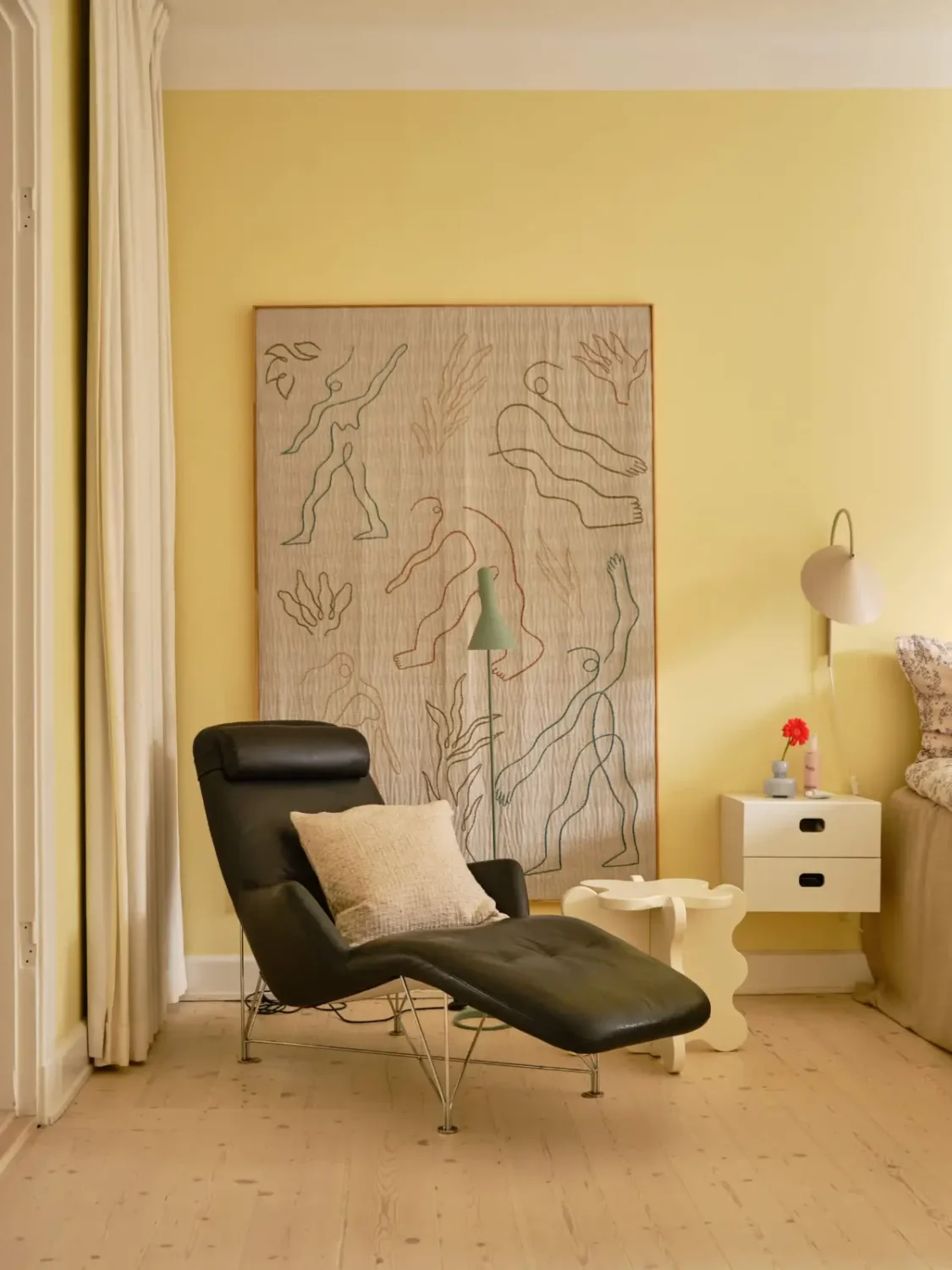 Pastel Hues in a Light-Filled 1880s Apartment in Stockholm 12 yellow bedroom black lounge chair nordroom